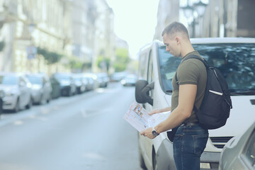 Wall Mural - tourists in the city with a map, trip travel city map tourism