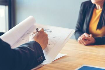 Job Interview HR human resource manager interviewing new employee candidate look at CV Resume asking job requirement question at business firm office desk. Job Interview headhunter agent application