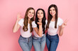 © deagreez - Photo of three young girls happy positive smile show peace cool okay sign send air kiss isolated over pastel color background