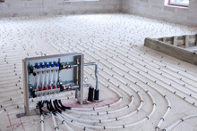 Underfloor Heating System - Water Pipes With Collector On The New Building Floor