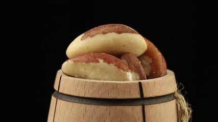 Poster - Brazil nut in a barrel spinning close-up