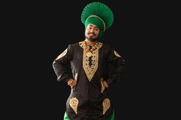 Wall Mural - A man in Bhangra Costume standing with hands on his waist.	