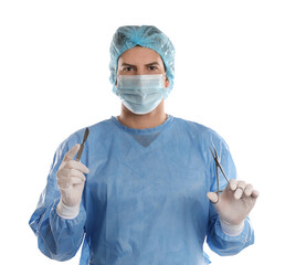 Poster - Doctor holding medical clamps and scalpel on light background. Surgical instruments