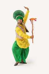 Wall Mural - A Bhangra Dancer performing with a Kato.	