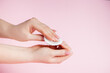 © Galina Atroshchenko - Hand care concept. Young woman remove nail polish on pink background. Place for text.