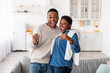 © Prostock-studio - Happy African American couple showing keys of their new apartment