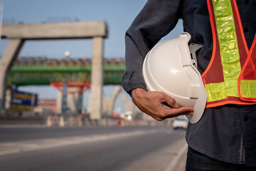 white helmet with an engineer who built an elevated road