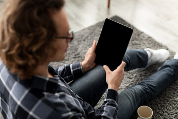 Poster - Guy Using Digital Tablet Computer With Empty Screen At Home