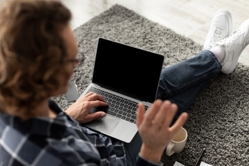 Poster - Guy Video Calling On Laptop With Blank Screen Indoor, Mockup