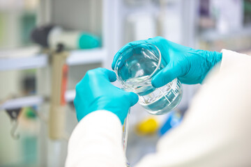 Wall Mural - Chemistry lab concept, scientist conduct experiments in a chemist laboratory