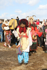 Wall Mural - Moscow Maslenitsa Festival. Traditional national celebration in russian folk style. Slavic tradition. Holiday performance with masked artists. Slavic Kremlin in Moscow city, Russia. Mask. Okrutniki