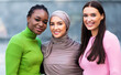 African American, Muslim And Caucasian Ladies Posing Together Standing Outside