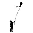 © KozyrevaElena - Silhouette little boy flying kite.