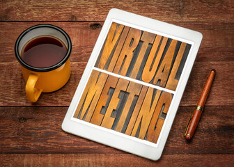 Canvas Print - virtual meeting word abstract in vintage letterpress wood type on a digital tablet with a cup of tea