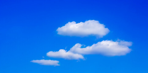 White clouds on a background of blue sky. Cloudy sunny day