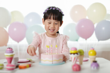 Wall Mural - young girl pretend playing food preparing at home