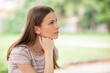 © Minerva Studio - Pensive woman in park Large copy-space