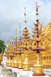 Golden flowers stands decoration around the amazing golden pagoda Shwezigon Paya of Bagan, Myanmar