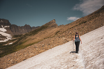 Poster - Woman treks across snowfield