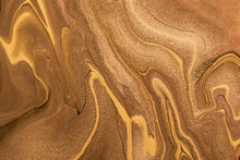 Abstract Fluid Art Background Golden And Copper Colors. Liquid Marble. Acrylic Painting With Brown Lines And Gradient.
