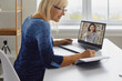 © Studio Romantic - Happy mature lady having video call with personal motivational coach. Senior woman sitting at desk at home, watching webinar on laptop, listening to online lecture, learning new stuff and taking notes