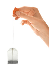 Wall Mural - Woman holding tea bag on white background