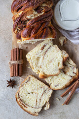 Wall Mural - Babka or brioche bread with cinnamon and brown sugar. Homemade pastry for breakfast. Top view.