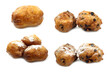 freshly baked traditional dutch oliebollen and some with currents and powdered sugar on a white background