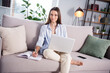 © deagreez - Photo of nice optimistic brunette long hairdo lady sit with laptop write wear shirt at home