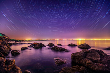 sea at night and beautiful Milky Way,  sea and star tracks