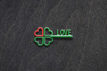 Four-leaf Green Clover Shaped Key With Red Heart As Symbol Of Love And Good Luck Concept