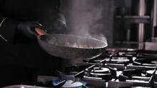 Close-up Of A Chef Working The Frying Pan For Roasting Mixed Colorful Vegetables, Tossing And Turning Them In The Air, Restaurant Kitchen , Slow Motion