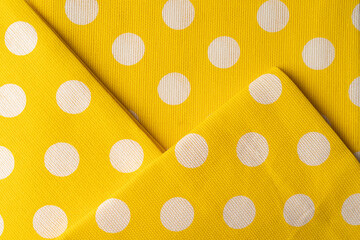 Wall Mural - Yellow cotton napkin with polka dot pattern. Napkin cotton for background