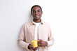 Smiling black guy with cup of coffee in the morning