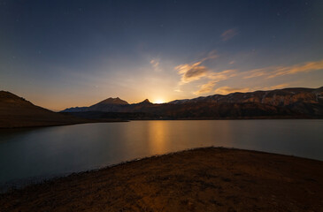 Wall Mural - moon rise in the mountains. beautiful night ladnscape lake and mountais, reflection in the water in 