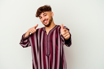 Young Moroccan man isolated on white background cheerful smiles pointing to front.