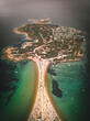 © AmazingAerialAgency - Aerial view of Isuledda, a small island with many boats sailing the turquoise Mediterranean Sea water, Sardinia, Italy.