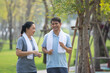 © Suriyo - Asian middle aged couple jogging, Asian man women running jogging exercise in city park on morning
