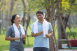 © Suriyo - Asian middle aged couple jogging, Asian man women running jogging exercise in city park on morning