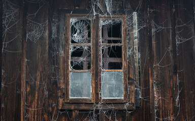 old wooden window with frozen spider web