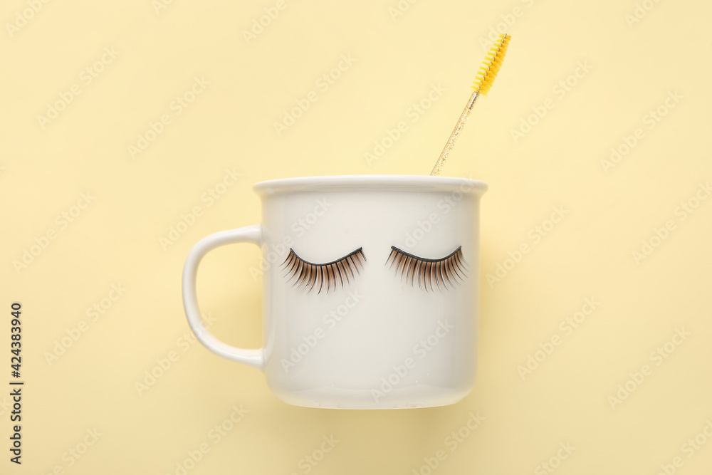 Creative composition with false eyelashes on color background
