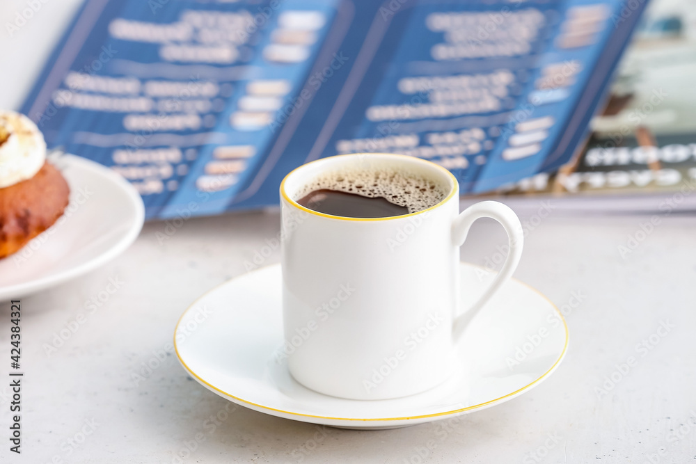 Cup of coffee on table in cafe