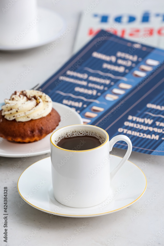Cup of coffee on table in cafe