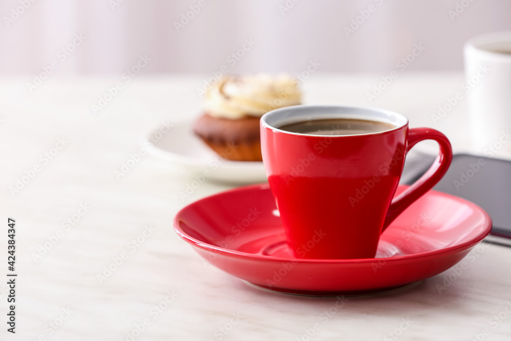 Cup of coffee on table in cafe