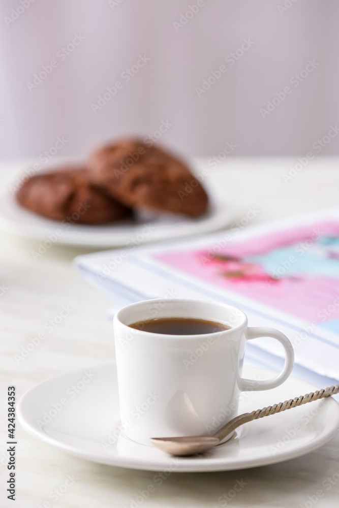 Cup of coffee on table in cafe