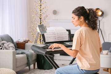 Poster - Young woman giving music lessons online at home