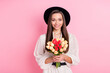 © deagreez - Photo of pretty charming young woman dressed white clothes cap holding tulip bunch isolated pink color background