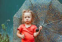 A Little Girl With An Umbrella
