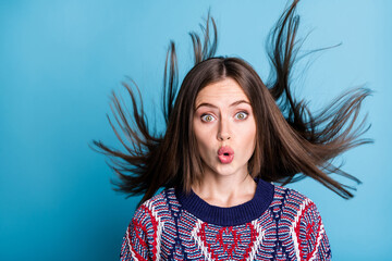 Poster - Portrait of attractive funny amazed girl pout lips hair flying isolated over bright blue color background