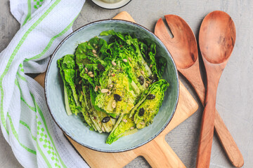 Wall Mural - Lettuce salad with olive oil dressing